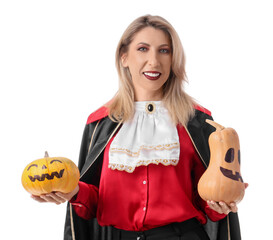 Happy mature woman dressed as vampire with pumpkins isolated on white background. Halloween...