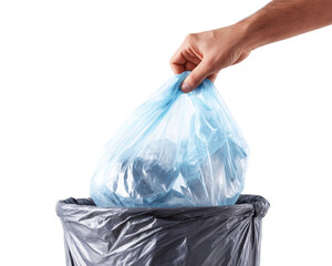 Close-up of a hand holding a plastic bag and garbage, depositing them into a bin against a white background.