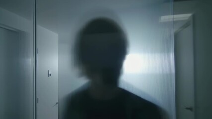 Blurred figure behind frosted glass - Powered by Adobe