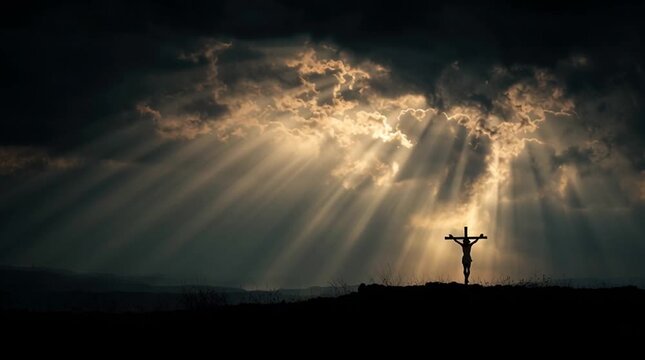 Silhouette of jesus christ on the cross with dramatic sky and sun rays shining through the clouds