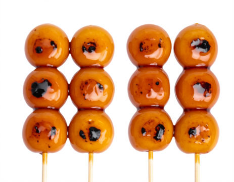 Delicious sweet dango skewers glazed with caramel sauce and lightly grilled for a perfect treat
