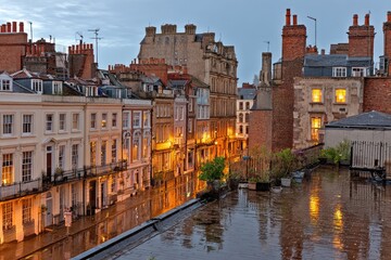 Rainy evening view of a historic English street