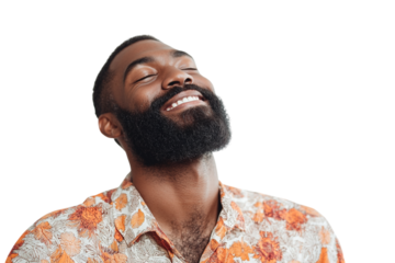 A bearded man in a patterned shirt smiles with closed eyes. Portrait, lifestyle photography.