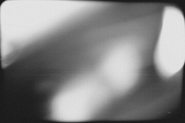 Obraz premium retro film overlay effect with scratch dust and light leaks,retro grain noisy film distressed texture light leak flare on black background,Black and white background