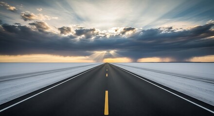 Fototapeta premium Endless highway stretches to the horizon beneath radiant sunbeams and dramatic sky