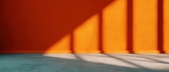 Sunlight casting long shadows on an orange wall in a minimalistic interior