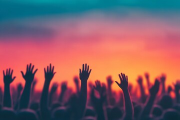 Silhouetted Hands Raised Against a Vibrant Sunset at an Outdoor Event