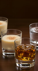 Close Up Photo of Various Drinks in Glasses on Wooden Table