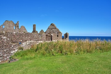 Ruins of Dunnottar Castle on Scotland's North Sea coast under a clear sky