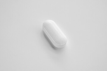 White medicine pill tablet on white background
