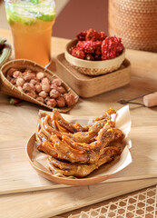 Duck feet marinated with traditional five spices, kitchen interior scene photography Chinese cuisine