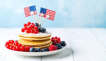 Stacked pancakes with berries and flags