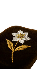 Isolated Embroidery Of A White Floral Design With Gold Accents PNG