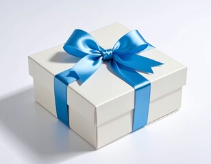 Obraz premium Elegant white gift box with a beautiful shiny blue satin ribbon bow, isolated on a white background for special occasions.