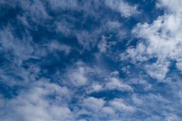 Cloudy skies. Cumulus clouds in sky. Cloud wallpaper. Sky background. Cloudy sky with sunlight. White clouds wallpaper. Blue sky and white clouds background. Idyllic fluffy clouds.