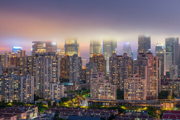 Obraz premium Shanghai Lujiazui Three-Piece in the mist at night