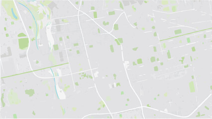Vector aerial view of a city with light gray buildings green patches and white roads creating an abstract pattern