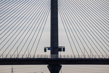 : Detailed view of the Mersey Gateway Bridge showing its central pylon and radiating support cables...