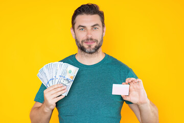 Portrait of lucky man holding cash dollar bills on yellow studio. Big luck, banner. Dollar cash...