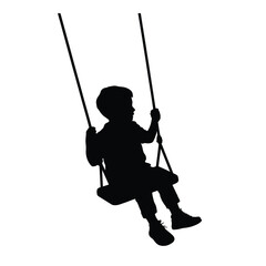Obraz premium Silhouette of a child swinging on a playground swing