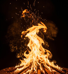 Vibrant bonfire with dancing flames and glowing embers creates a warm, inviting atmosphere perfect for outdoor gatherings and cozy evenings