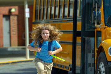 School bus waiting for child student outdoors. Kid with backpack and books to go school. Outdoor...