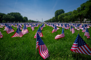 US flags near the Washington Monument. USA banner on Independence Day. National Mall in DC with...