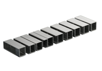Isolated Group of Metal Staples Arranged in a Row on a Black Background
