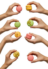 Isolated Hands Holding Colorful Macarons Against a Transparent Black Background