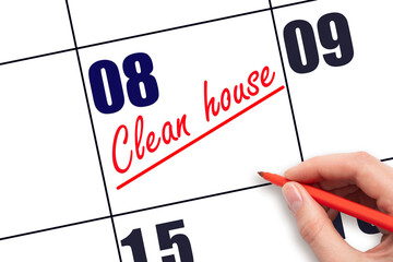8th day of the month.  Hand writing Clean house reminder and drawing a line on calendar with red...