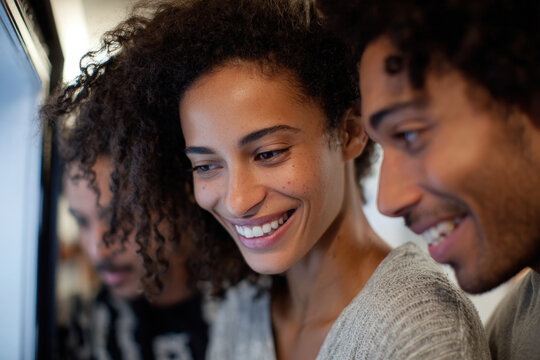 smart refrigerator displaying virtual recipe suggestions evoking emotions of joy and discovery