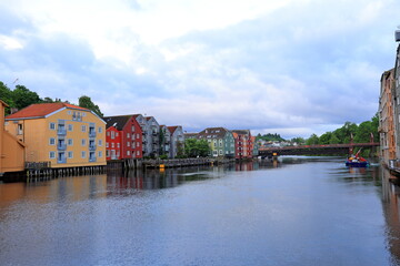 : Scenic riverside place with lots of colorful houses in Trondheim, Norway