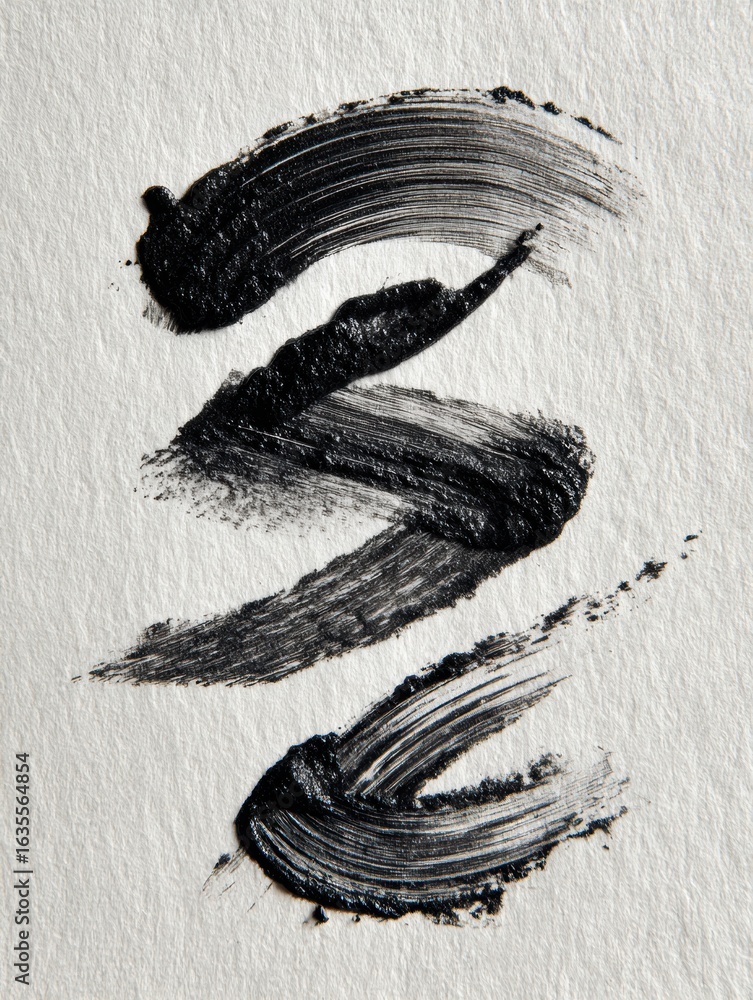 Poster smudged eyeliner strokes create abstract shapes on textured paper with the right margin left untouch