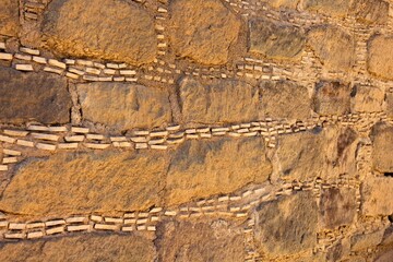 Closeup of a wall showing how at the Salmon Pueblo, New Mexico, they place tine stones between the large ones.