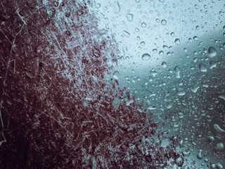 Water droplets on scratched rusty metal surface 