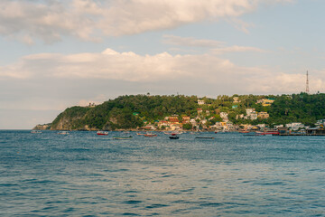 Naklejka premium Puerto Galera, Philippines - 3 may 2025 a tourist destination , need a ferry ride to get to this Island