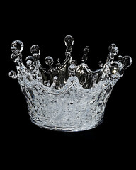 water in dynamic motion, isolated on black background for commercial use.