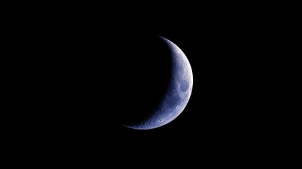 Beautiful Crescent Moon Illuminating Night Sky with Dark Backdrop Creating a Serene and Tranquil Atmosphere Perfect for Nighttime Reflection and Wonder