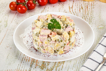 Russian traditional Olivier salad with sausages