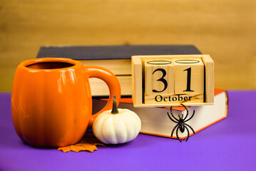 A wooden calendar for October 31st filled with vibrant fall colors and delightful seasonal props.