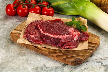 Raw beef cheeks cut for cooking