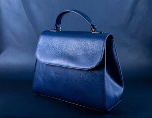 Dark blue leather handbag on dark background