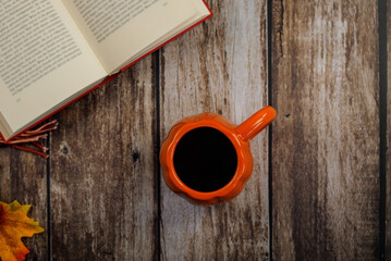 Embrace the Cozy Autumn Vibes with a Warm Mug of Coffee and a Good Book for Relaxation