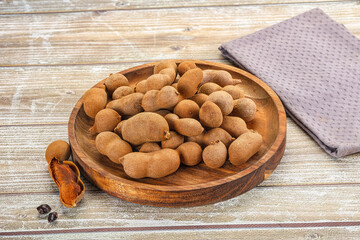 Tropical exotic Tamarind fruit heap