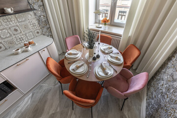 Top View of Stylish Kitchen Table Setting with Velvet Chairs