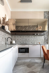 Modern Kitchen with Patterned Tiles and Elegant Dining Area