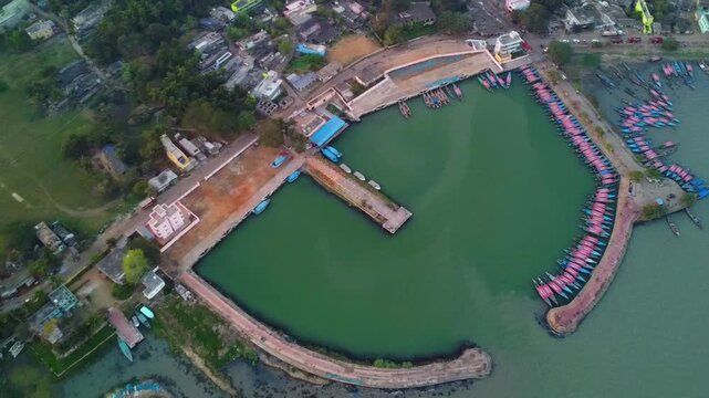 lots of boats berthing in chilika lake harbour cinematic aerial drone view 