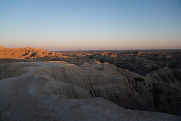 Badlands rock formations at sunset