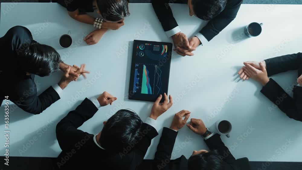 Poster top down aerial view of group of business people looking at financial chart while analyze and explai