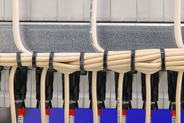View of the electrical panel from the side of the arrangement of electrical wires and cables....